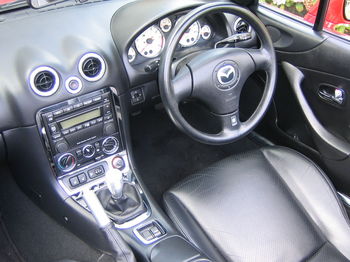 1280px-2002_Mazda_MX5_1.8_Sport_Black_Interior.jpg